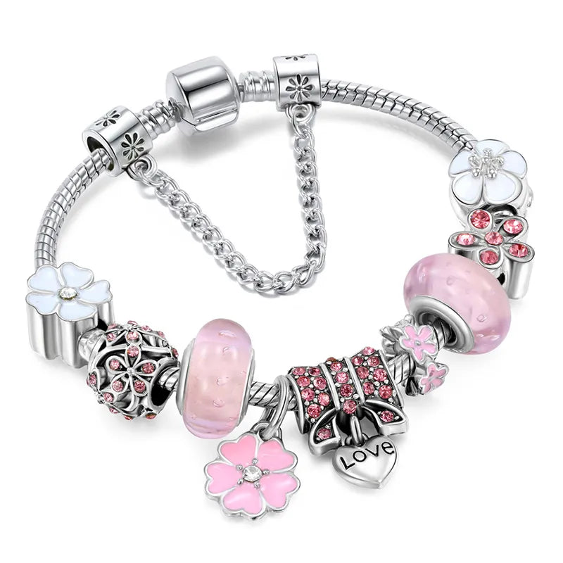 Elegant pink charm bracelet with sterling silver floral beads, pink glass charms, and a heart pendant engraved with 'Love' – perfect women's jewelry accessory and gift.