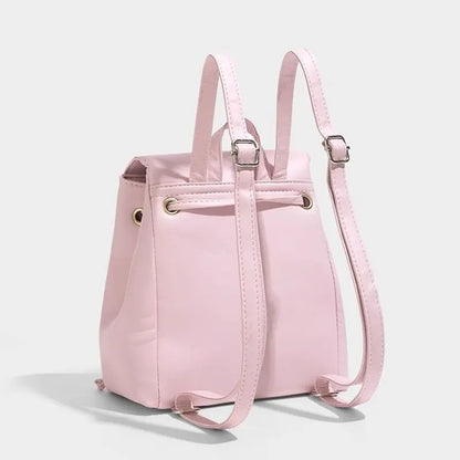 Small Pink Backpack with Embroidered Design and Drawstring Closure