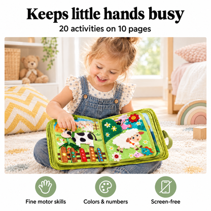 Toddler playing with the farm busy book
