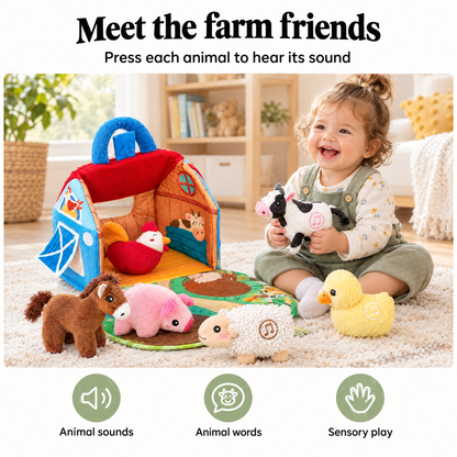 Baby playing with the plush barn and farm animals